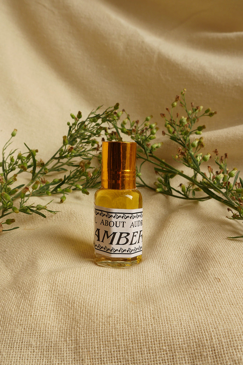 Amber Essential Oil Perfume, a small glass bottle with a vintage style metal screw top. By All About Audrey