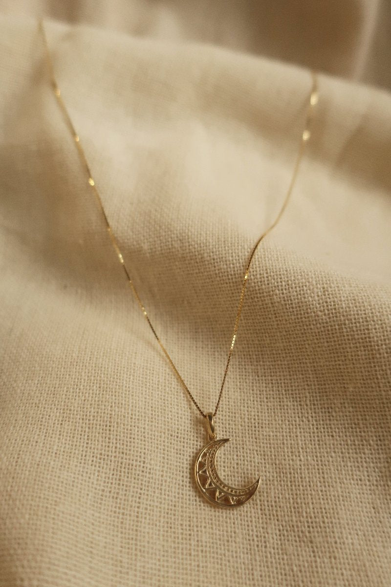 Gold Cut Out Crescent Moon Charm Necklace by All About Audrey