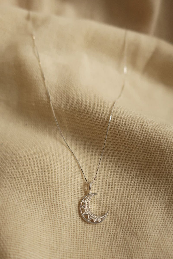 Silver Cut Out Crescent Moon Charm Necklace by All About Audrey