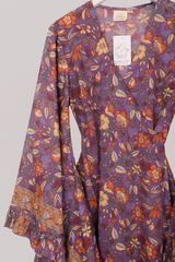 Venus Folklore Floral Mini Wrap Dress in Hibiscus Purple by All About Audrey