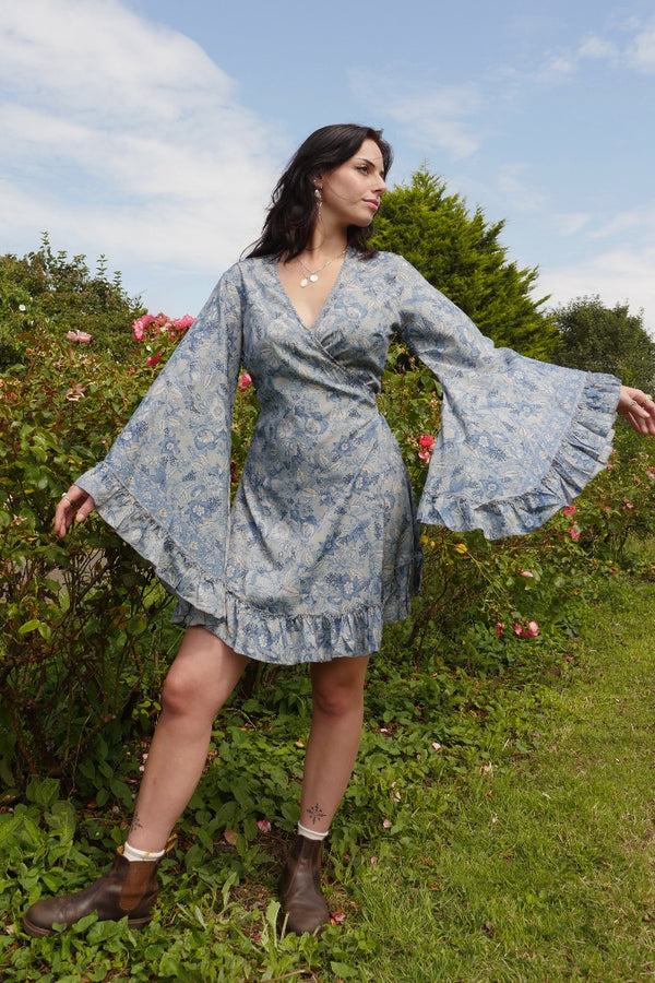 Venus Folklore Floral Mini Wrap Dress in Forget Me Not Blue by All About Audrey