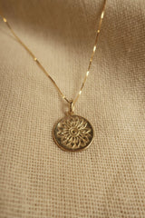 Gold Marigold Charm Necklace by All About Audrey