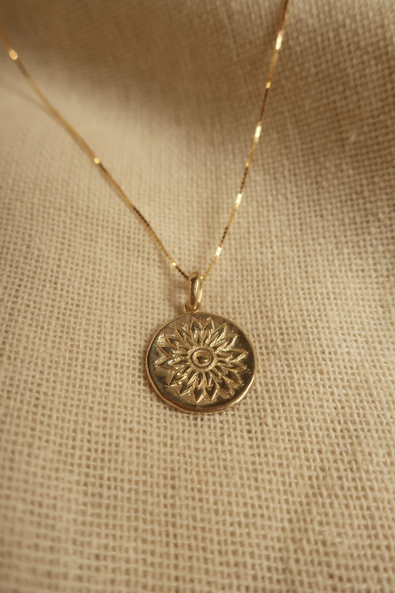 Gold Marigold Charm Necklace by All About Audrey