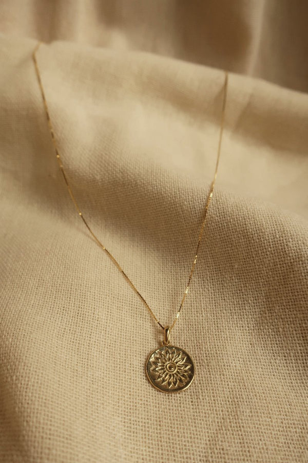 Gold Marigold Charm Necklace by All About Audrey