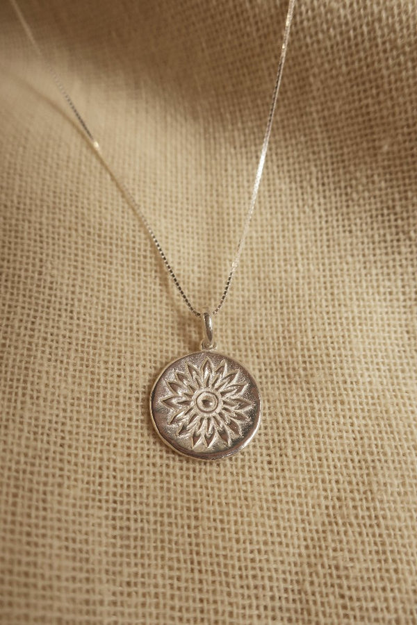 Silver Marigold Charm Necklace by All About Audrey