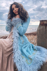 model wears fleetwood penny lane 70s faux suede coat hippy afghan faux fur jacket in baby blue with floral embroidery by all about audrey