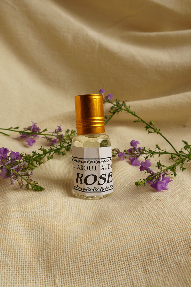 Rose Essential Oil Perfume, a small glass bottle with a vintage style metal screw top. By All About Audrey