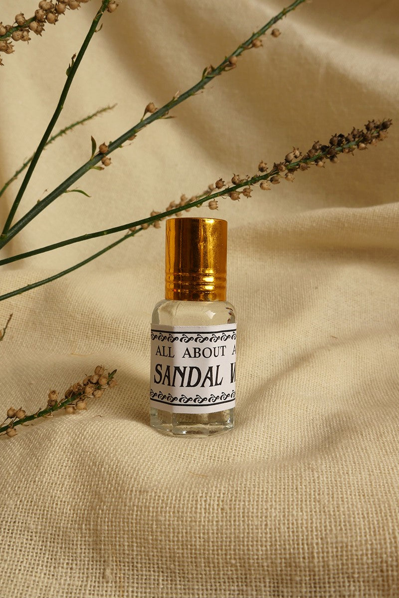 Sandal Wood Essential Oil Perfume, a small glass bottle with a vintage style metal screw top. By All About Audrey