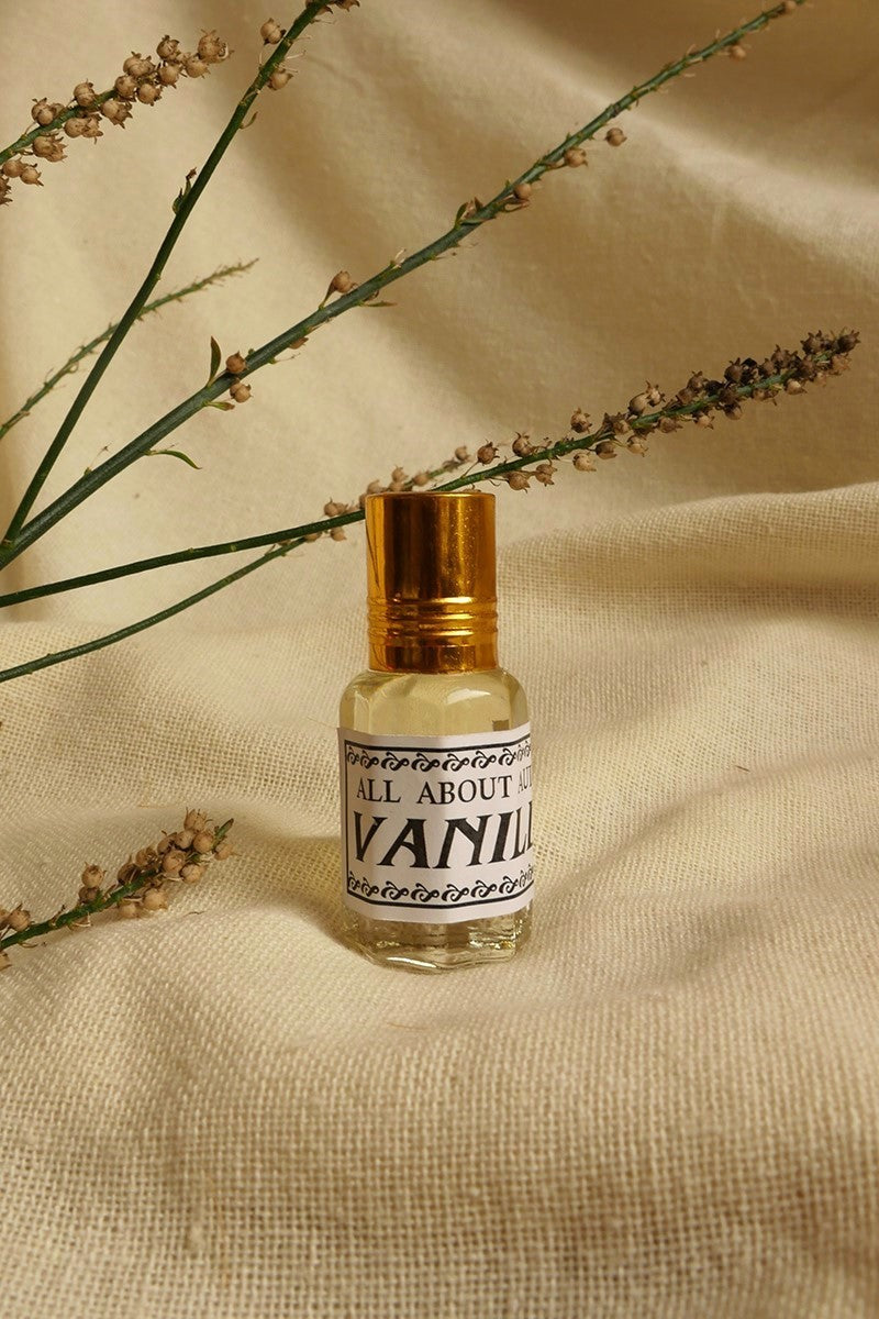 Vanilla Essential Oil Perfume, a small glass bottle with a vintage style metal screw top. By All About Audrey