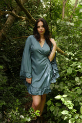 model wears Khroma Venus Mini Wrap Dress in Petrol Blue by all about audrey