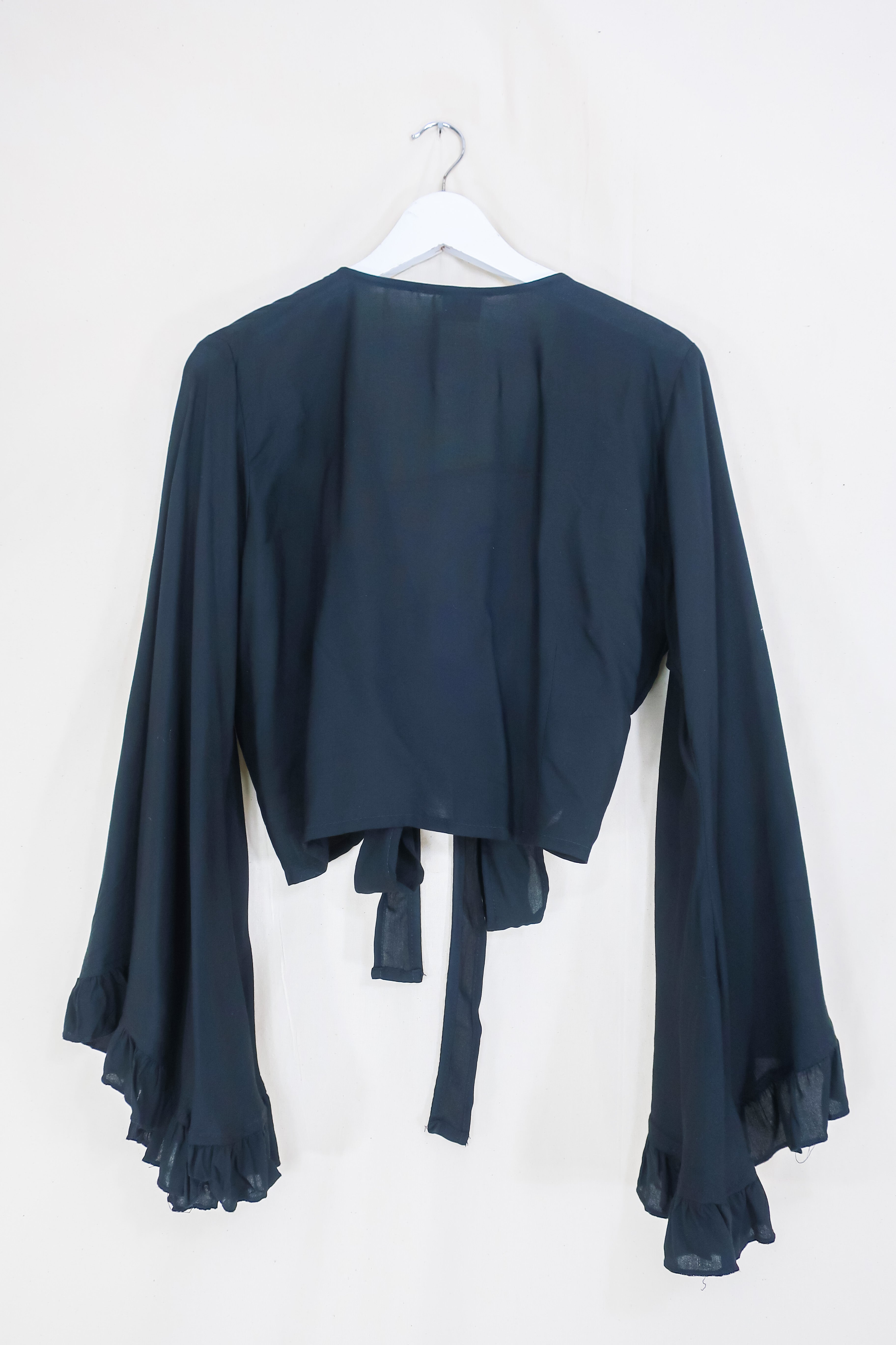 Frill Bell Sleeve Venus Wrap Top | Nightshade Black | All About Audrey ...